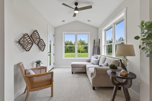 4-season porch with vaulted ceiling. This room is bathed in natural light from the abundance of windows.
