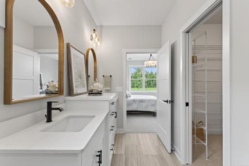 Primary walk-in closet sensibly located off the bathroom.