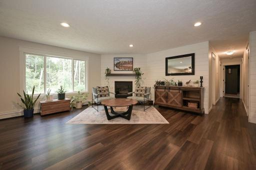 Light filled Living room with Natural Gas fireplace