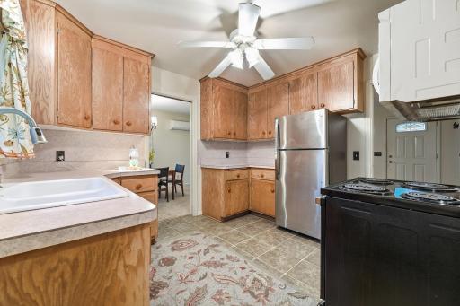 Kitchen cabinets go to the ceiling to create more storage space.