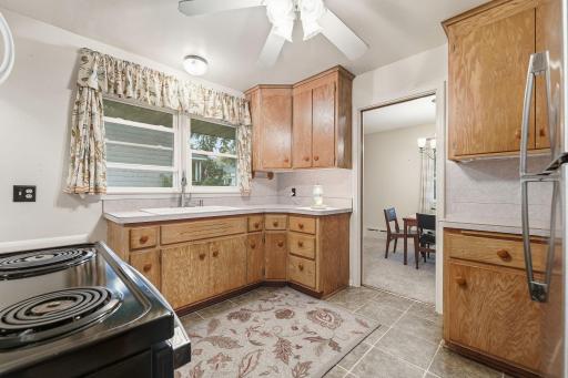 Kitchen into dining area. Space functions great as is or could be remodeled for an incredible space to create meals.