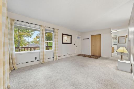 Step into your light filled living room. Pella windows installed in 2011 to create a more efficient home. Solid oak floors under most of the rooms.