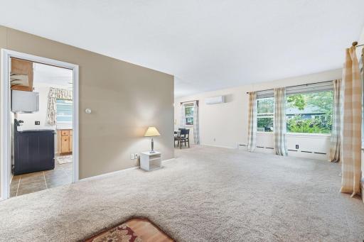 Living area opens into the kitchen. Mini split provides air-conditioning. Boiler heat creates even clean heat in cold winter months.