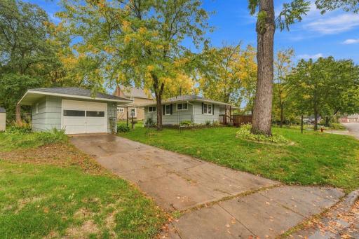 Your concrete driveway leads to the one car garage. Large trees to provide shade and colors.