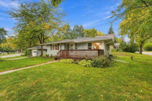 Front yard leading to a great deck space that has partial roof covering.Check out the perennials so many possibilities with this yard.