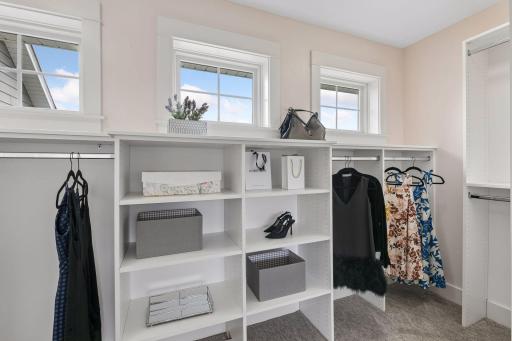 This lovely walk-in is complete with a closet system, too!