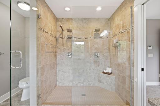 Large & luxurious tiled shower with dual shower heads!