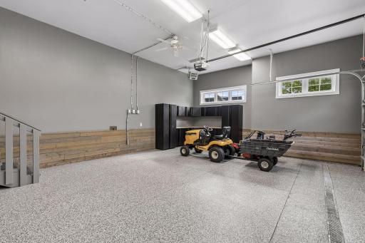 You'll appreciate the 3 car heated garage with epoxy floors, ceiling fans, shelving and workbench storage system.
