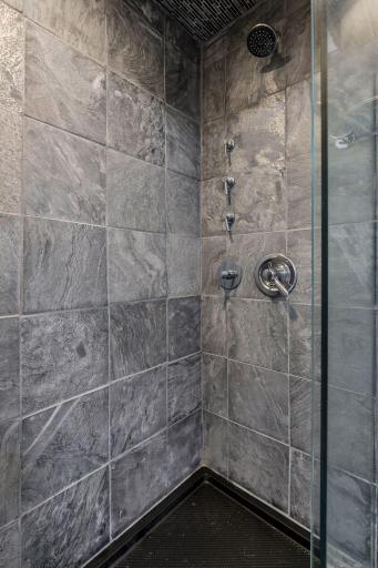 Tiled shower in the lower level 3/4 bath.