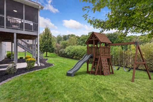 Virtually staged playset showing the possibilities in this private backyard.