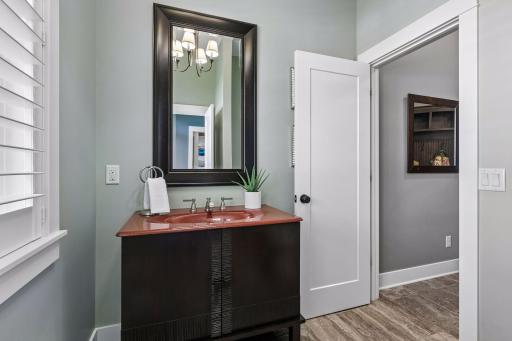 Main level Powder Room efficiently designed with dual access from both the front entry & the mudroom!