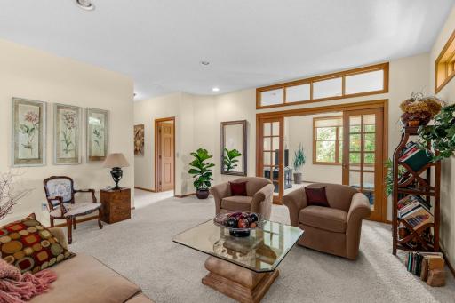 Living room view to sunroom and bedroom areas