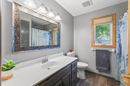 Private primary bath with plenty of storage and a full tub/shower.