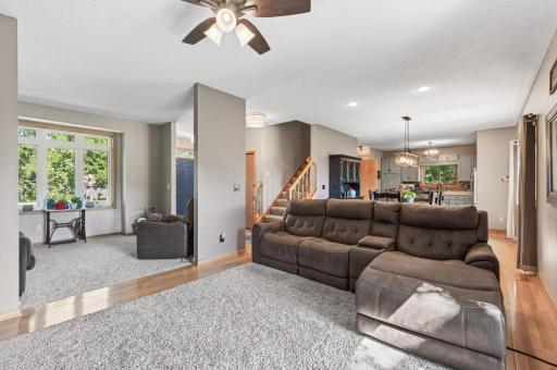 Open main-level layout offers plenty of space to gather, with the living room flowing easily into the kitchen and dining area.