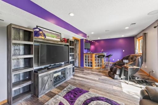 The lower level is made for entertaining with a spacious family room, built-in bar, and plenty of room for game day or movie night.
