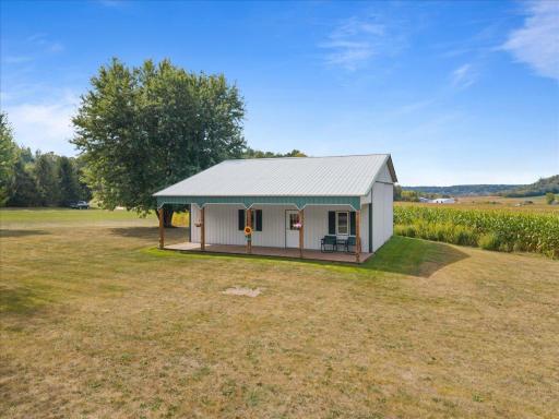 30x36 Pole shed with 9x36 deck to enjoy those late summer days.