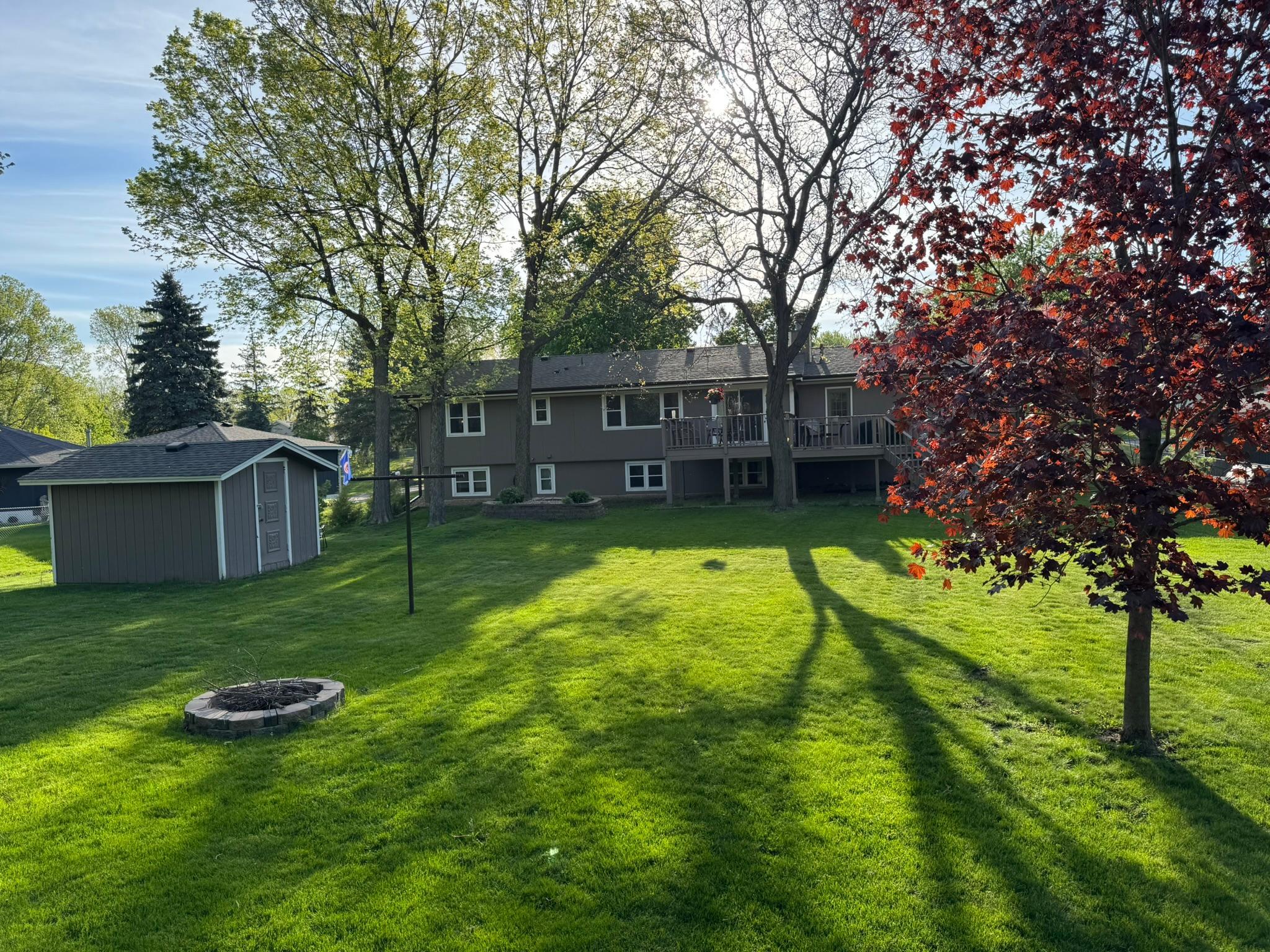 Temp Photo of exterior with fire-pit, multi-level deck with stairs to yard and Shed (Back of home)
