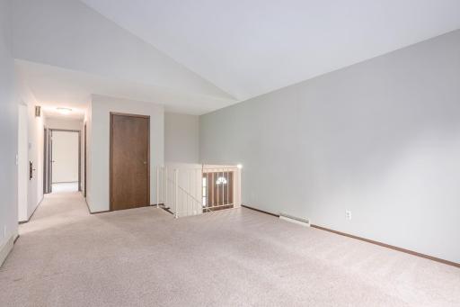 Main level living room looking to bedrooms and bath