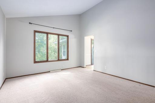 Main level living room looking to back yard and Dining Room