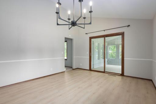 Dining area looking to 3 season porch and living room walkway