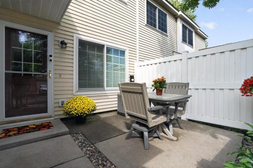 Enjoy an east facing, private patio outside the front door of this home.Fill it with potted plants. Have your favorite beverage and enjoy the shade of the afternoon