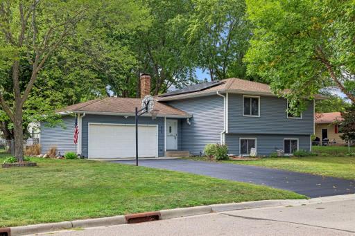 Classic split-entry home with great curb appeal, featuring attractive landscaping, a welcoming entryway, and well-maintained exterior details that create a lasting first impression.
