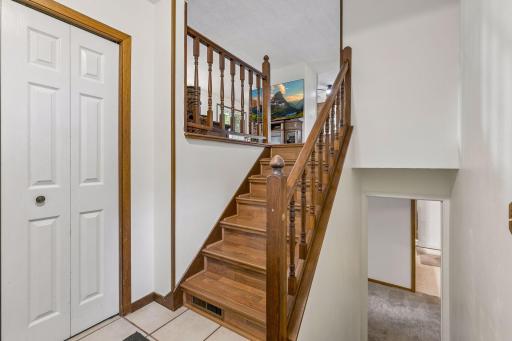 Spacious front entry with a large coat closet and convenient access to the attached garage.