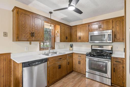 The updated kitchen features gorgeous new granite countertops, stainless steel appliances, and continuous flooring throughout the main level, creating a seamless flow and modern appeal that's perfect for everyday living and entertaining.