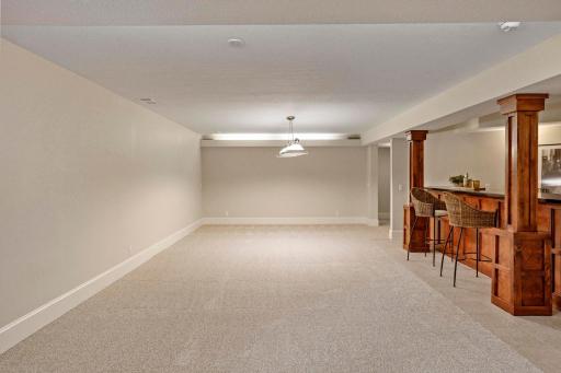Rear hallway leads to 4th bedroom, and the secondary hallway to the utility room.