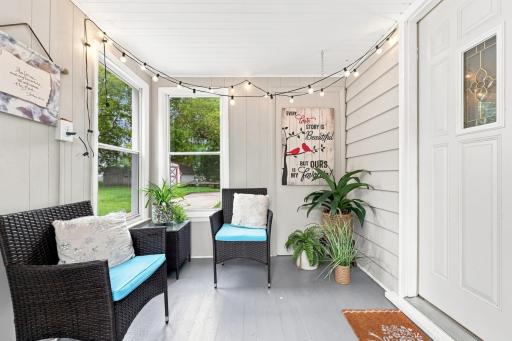 This inviting three-season porch extends your living space outdoors, providing a cozy retreat for relaxing, entertaining, or taking in the beauty of the backyard throughout much of the year.