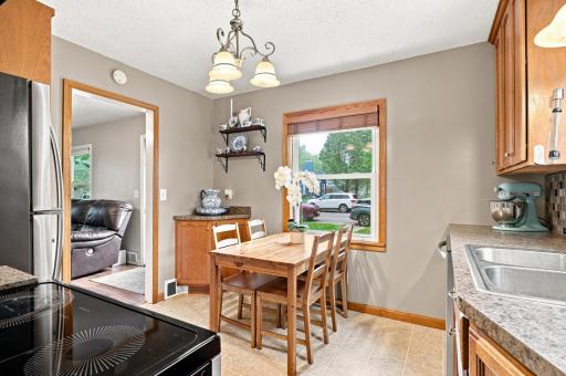 Bright eat-in kitchen with abundant natural light, perfect for everyday meals and morning coffee.