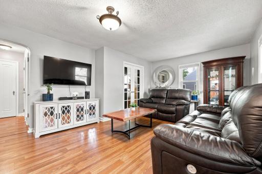Bright and inviting living room with beautiful flooring and plenty of space to relax, gather, and entertain.