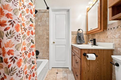 Beautifully updated bathroom with warm finishes and a fresh, inviting feel.