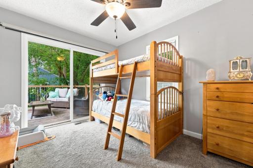 Bright bedroom with direct deck access, creating a seamless connection between indoor comfort and outdoor living.
