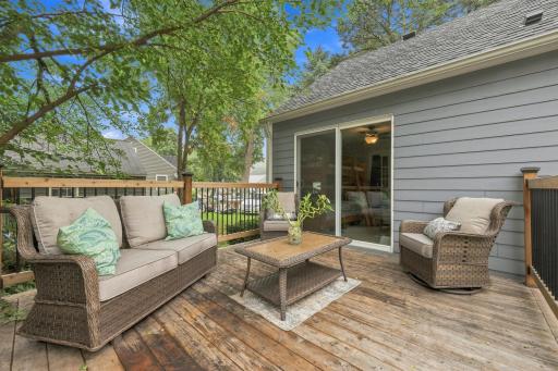 Enjoy peaceful moments and beautiful memories on this inviting deck, surrounded by mature trees and the perfect setting for relaxing or entertaining
