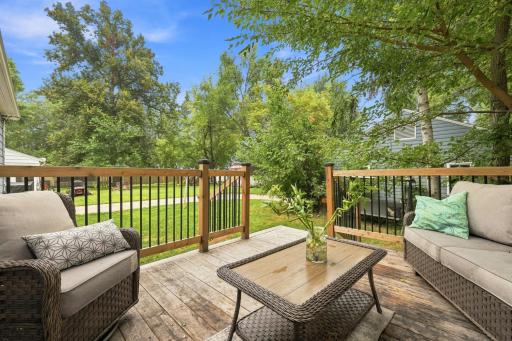 Relax and unwind on the spacious backyard deck, the perfect setting for outdoor entertaining, morning coffee, or enjoying peaceful surroundings.