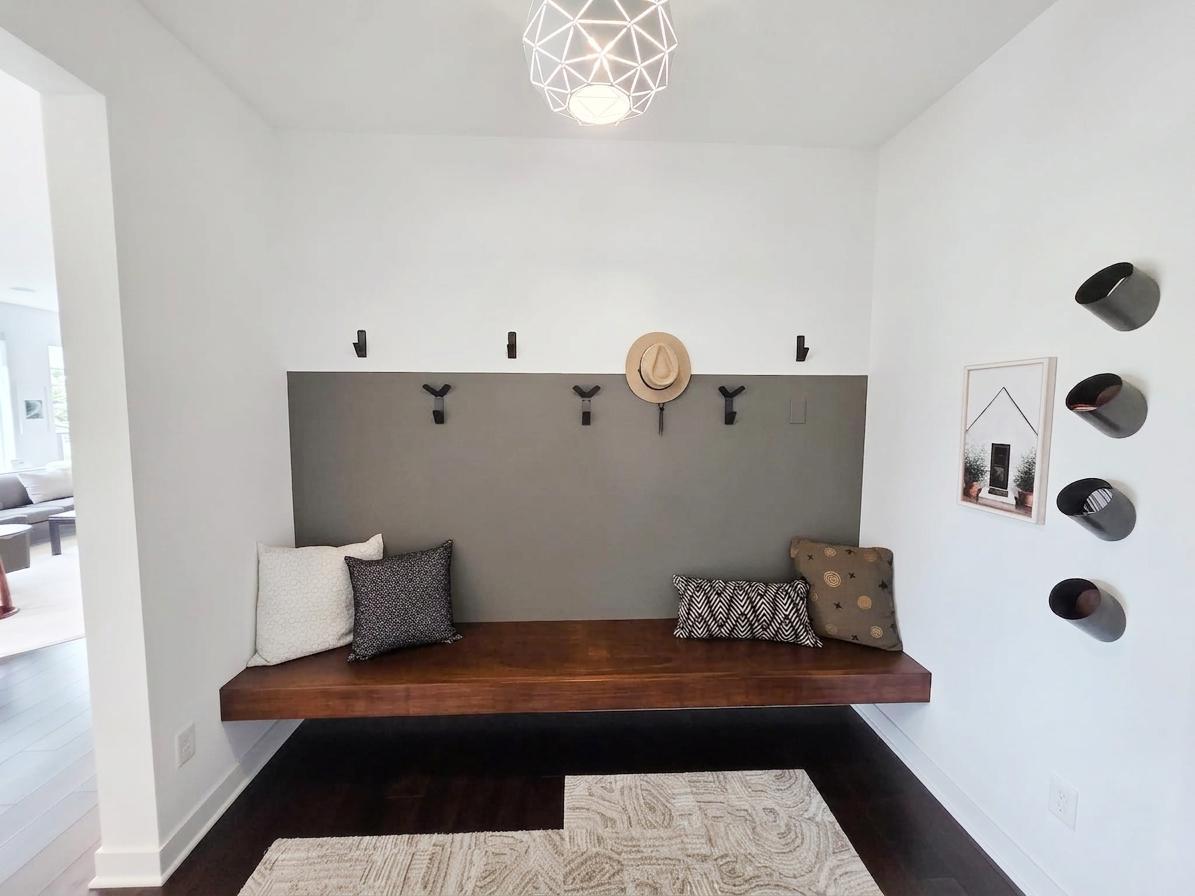 Built-in mudroom bench creates a convenient everyday drop zone just inside the garage entry.