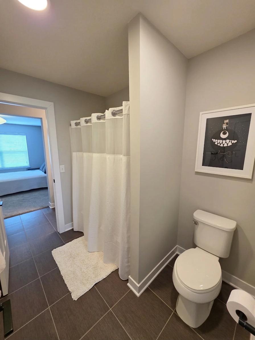 Full Jack-and-Jill bath includes tub/shower and convenient access between two upper-level bedrooms.