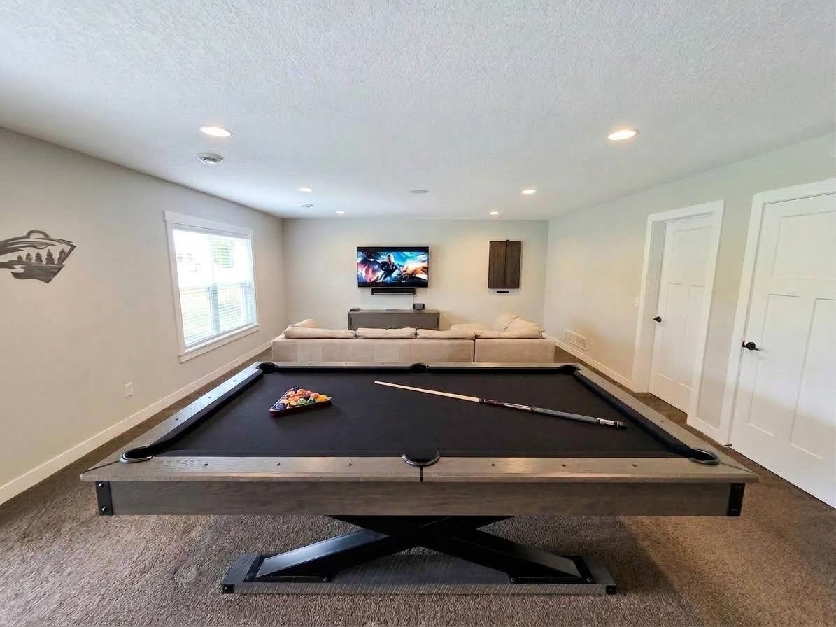 Spacious finished lower-level recreation room offers room for media, games and multiple seating areas.