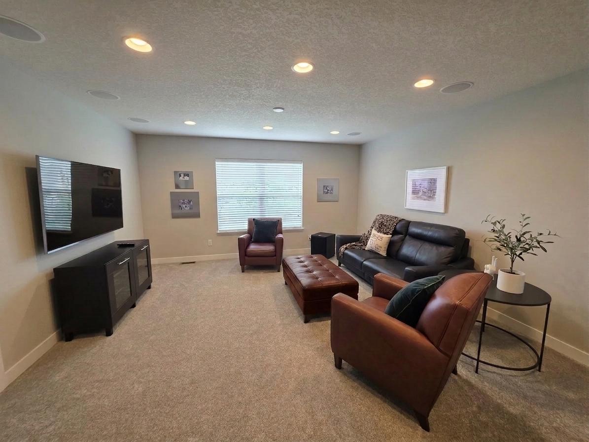 Upper-level loft offers a flexible second living area with built-in 5.1 surround-sound speakers.