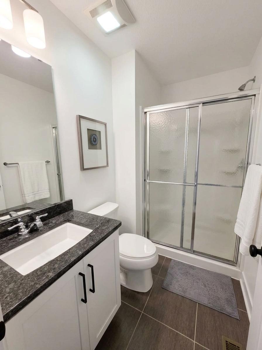 Upper-level 3/4 guest bath provides a private shower bath separate from the primary suite and Jack-and-Jill bath.