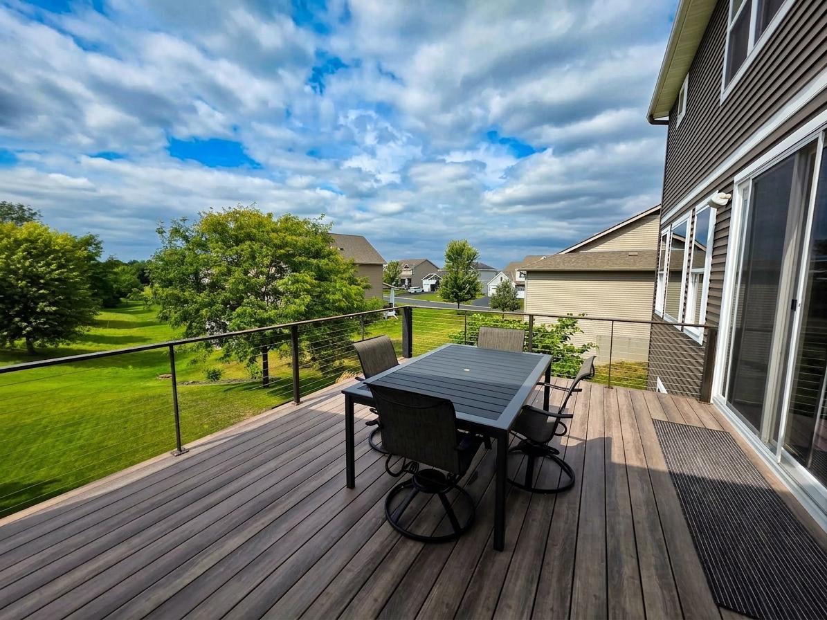 Open-air deck offers additional dining and entertaining space with maintenance-free decking and cable railing.
