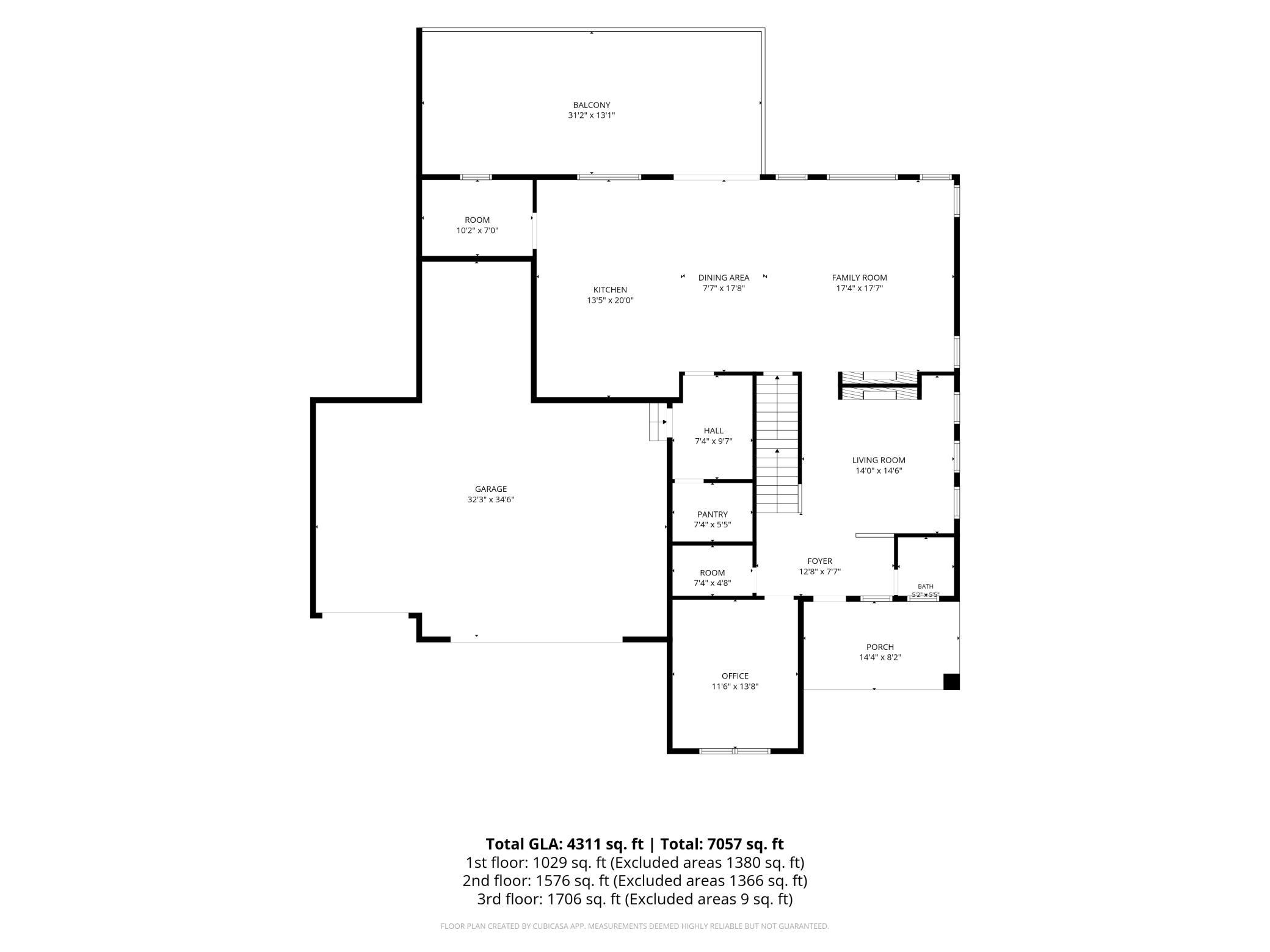 Main-level floor plan showcases the open kitchen/dining/family-room arrangement, fireplace lounge, private office, mudroom, four-stall garage and expansive deck