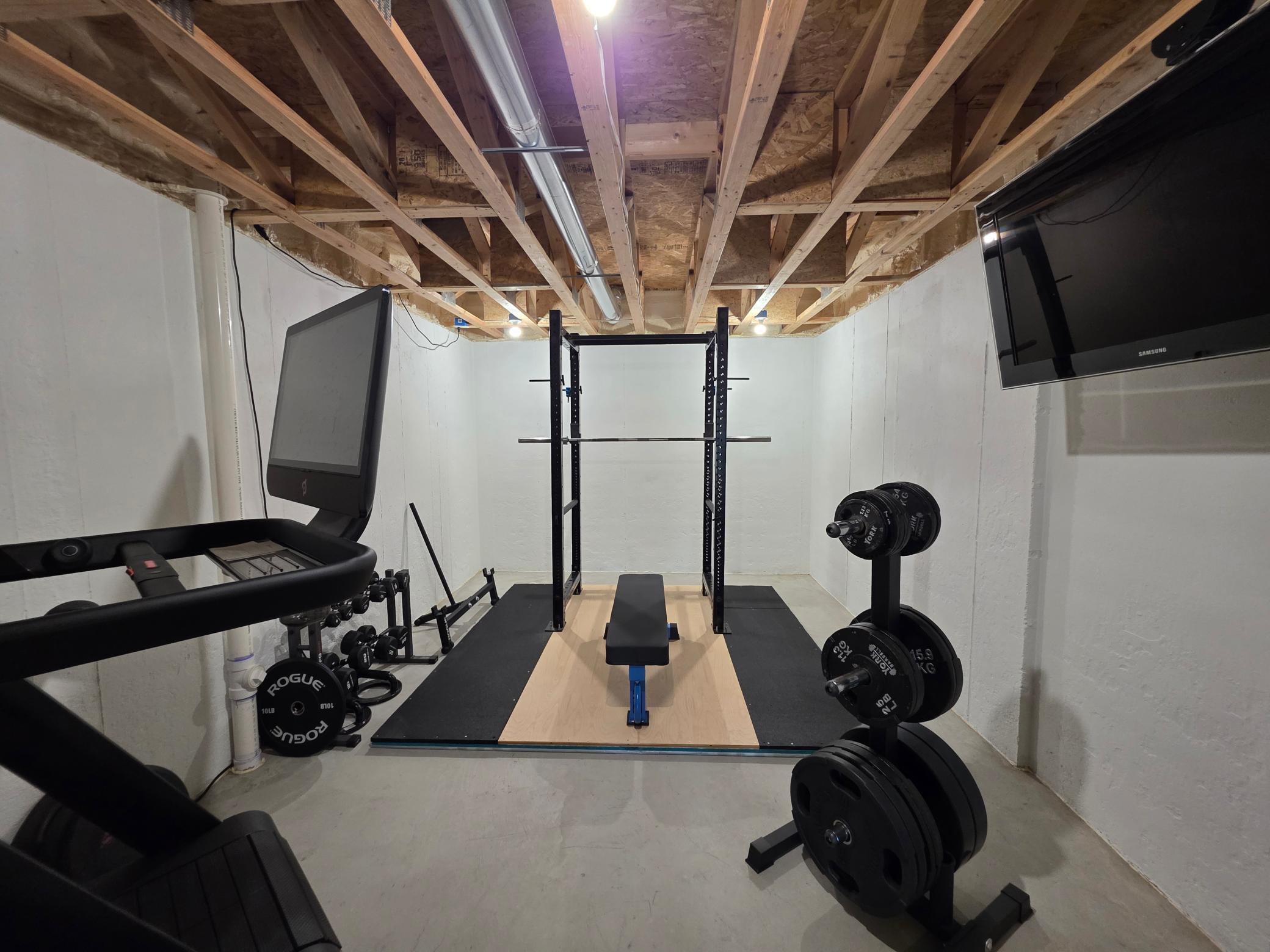 Heated unfinished exercise room offers dedicated fitness, hobby or flex space; not included in finished living-area measurement