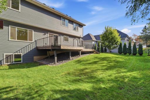 Extra large deck only a few years old overlooks the private fully fenced backyard.