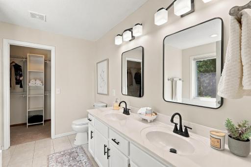 Dual sinks, walk-in closet, tub and separate shower make up the primary en-suite