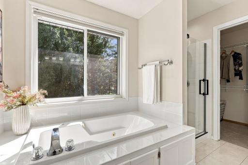 Primary bathroom with nice big windows let in lots of light