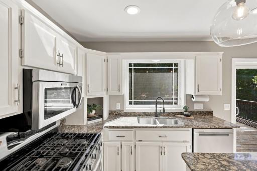 Big window overlooking your backyard while cleaning up dishes