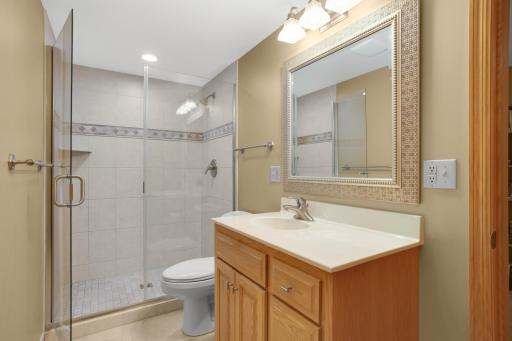Stylish lower level 3/4 bath with tiled shower