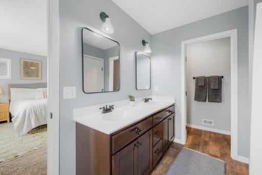 3/4 primary suite with double sinks and private water closet
